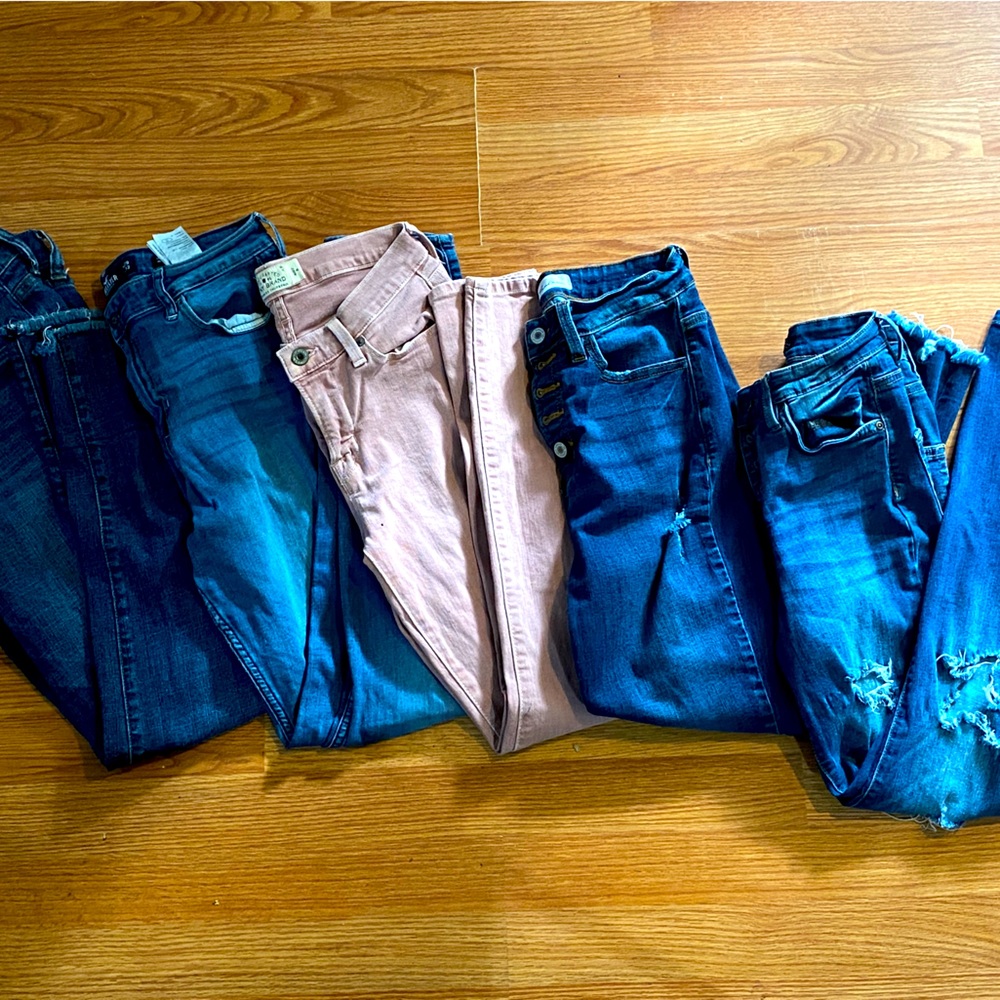 5 pair of womens jeans. Sizes vary. Different brands